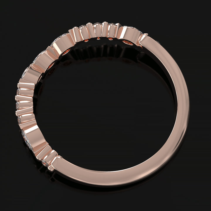 Curved wedding band with marquise and round lab-grown diamonds in a floating design with shared prongs.