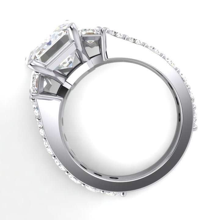 Emerald three stone engagement ring