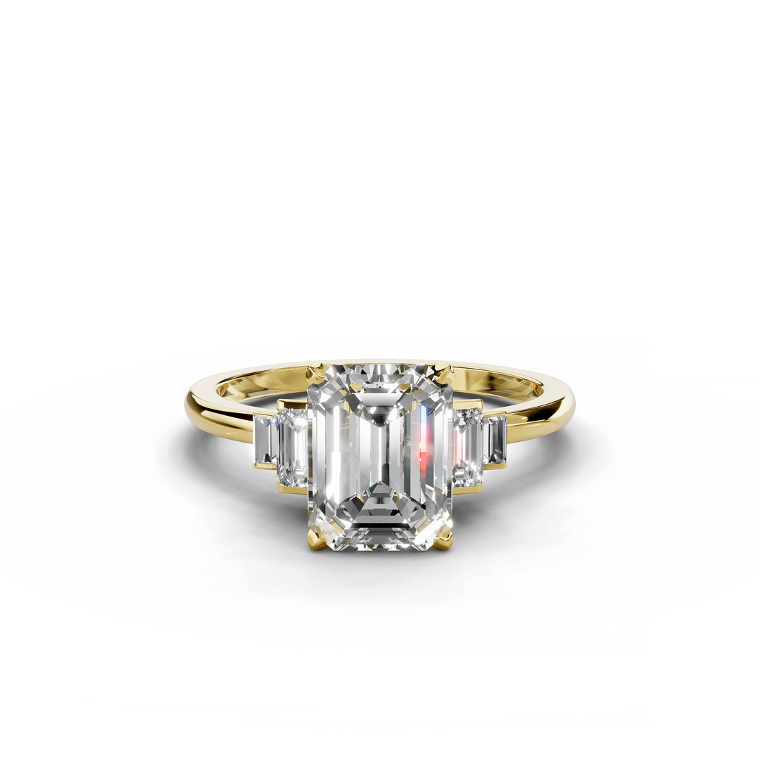 Emerald cut diamond five stone engagement ring in yellow gold.