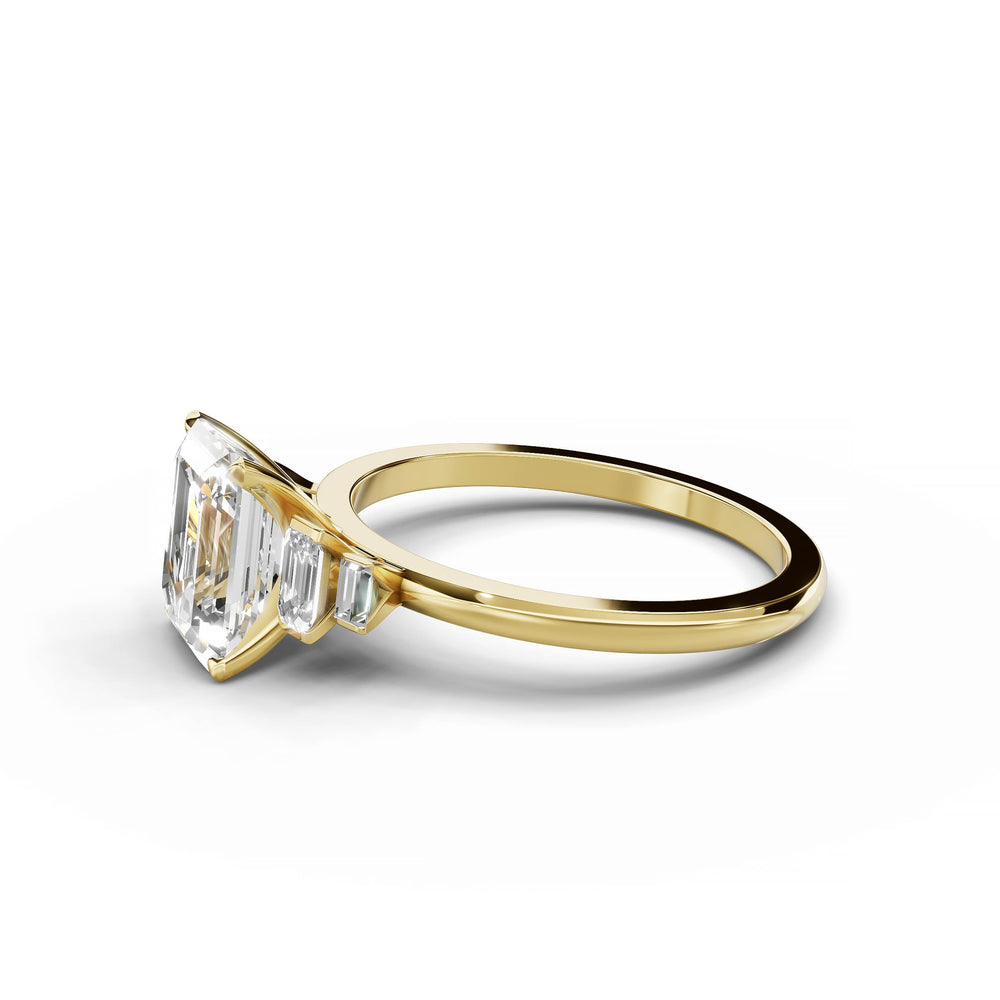 Emerald cut diamond five stone engagement ring in yellow gold.