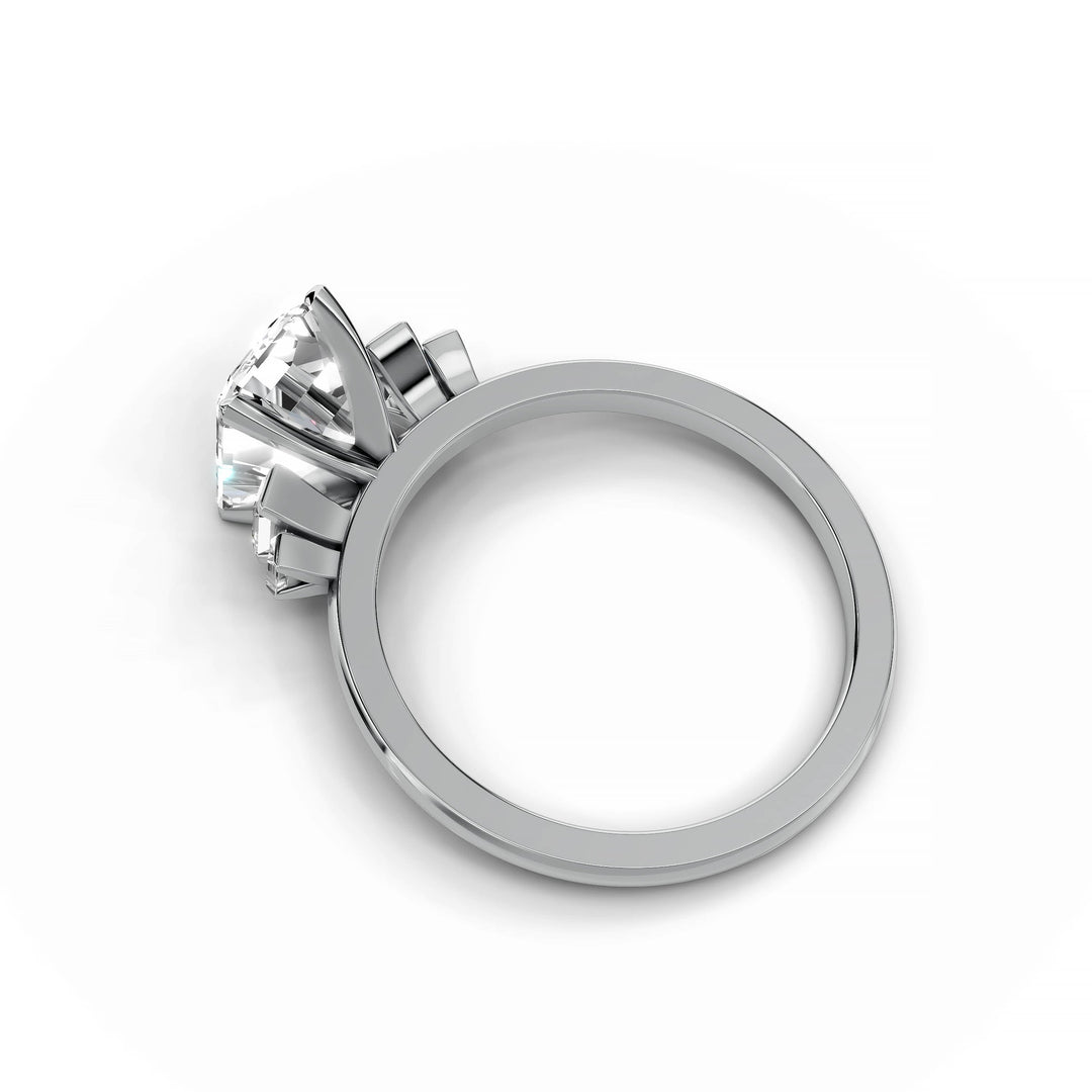 Emerald cut diamond five stone engagement ring in white gold.