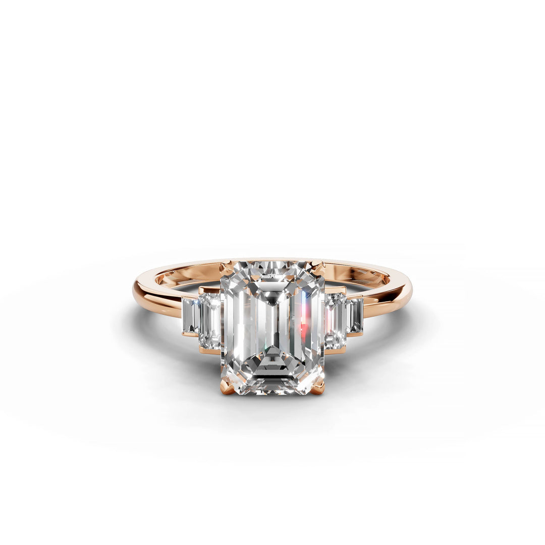 Emerald cut diamond five stone engagement ring in rose gold.