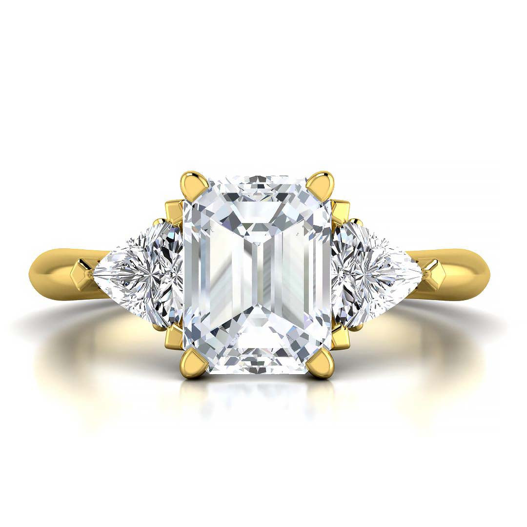 Emerald cut three stone engagement ring