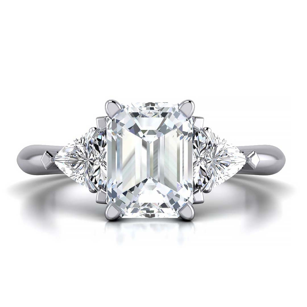 Emerald cut three stone engagement ring