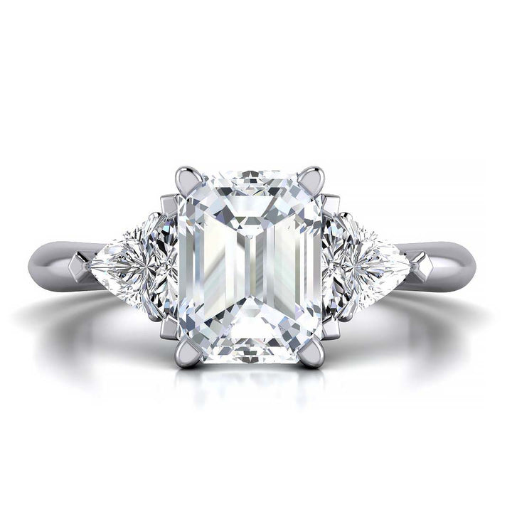 Emerald cut three stone engagement ring