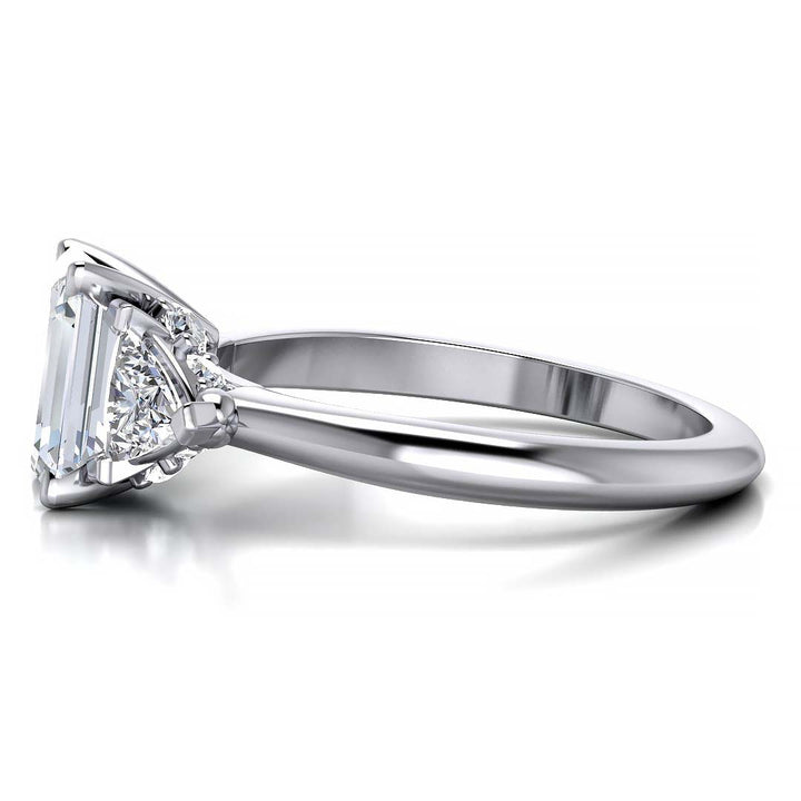 Emerald cut three stone engagement ring