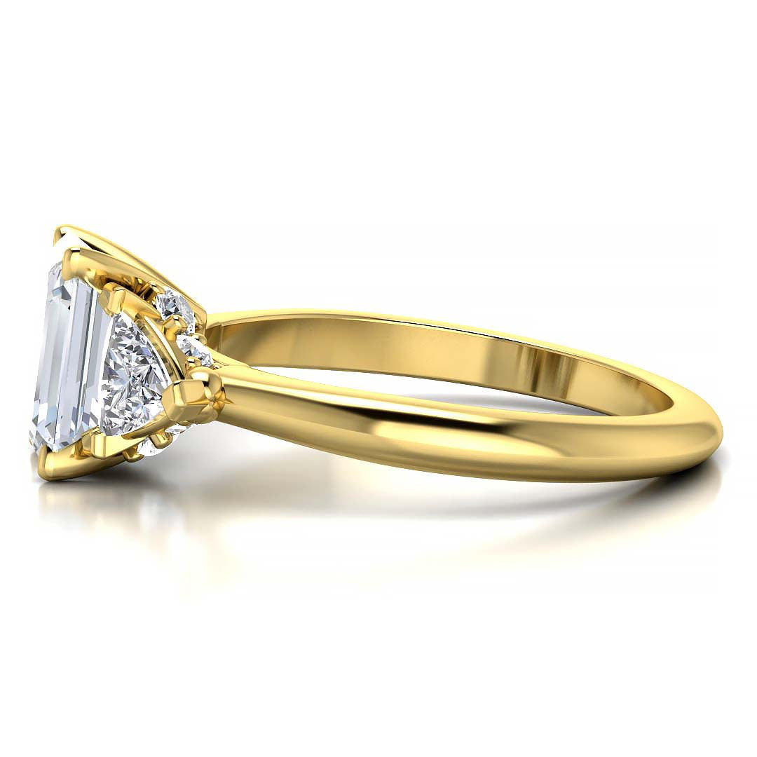 Emerald cut three stone engagement ring