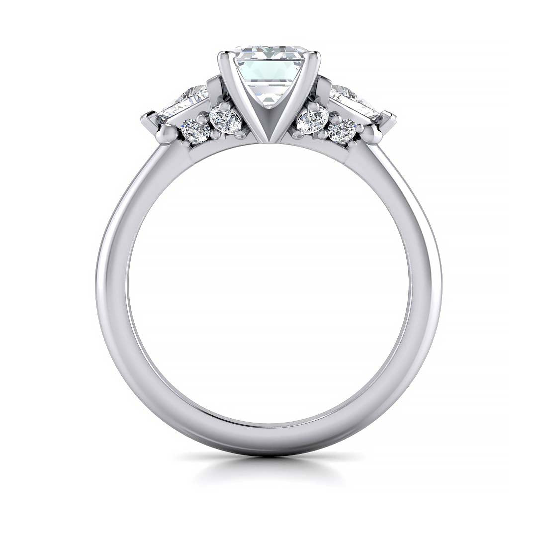 Emerald cut three stone engagement ring