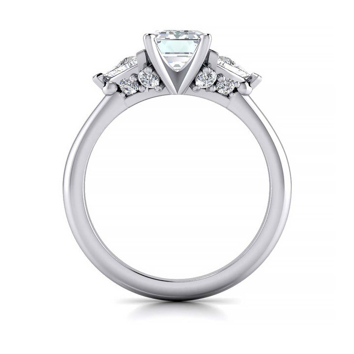 Emerald cut three stone engagement ring