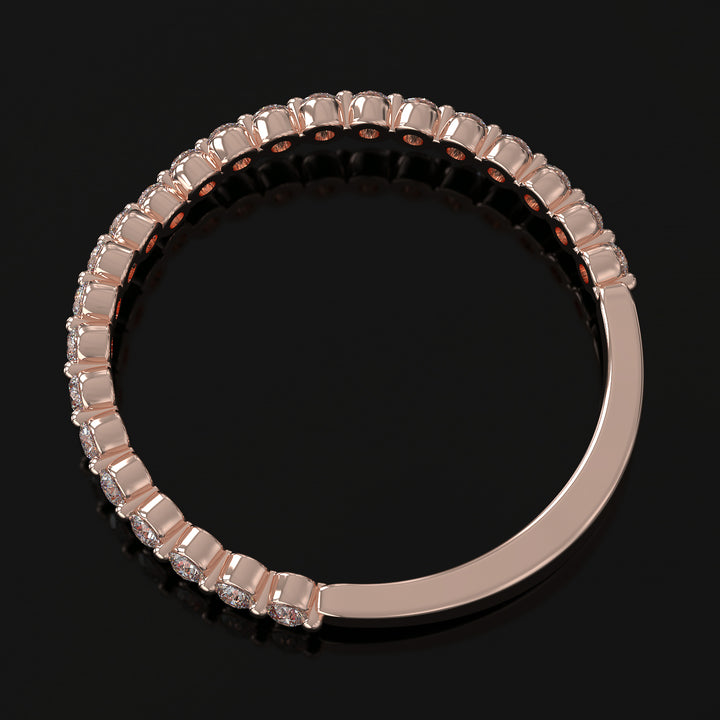 Floating lab grown diamond V-shaped wedding band with shared prong setting.