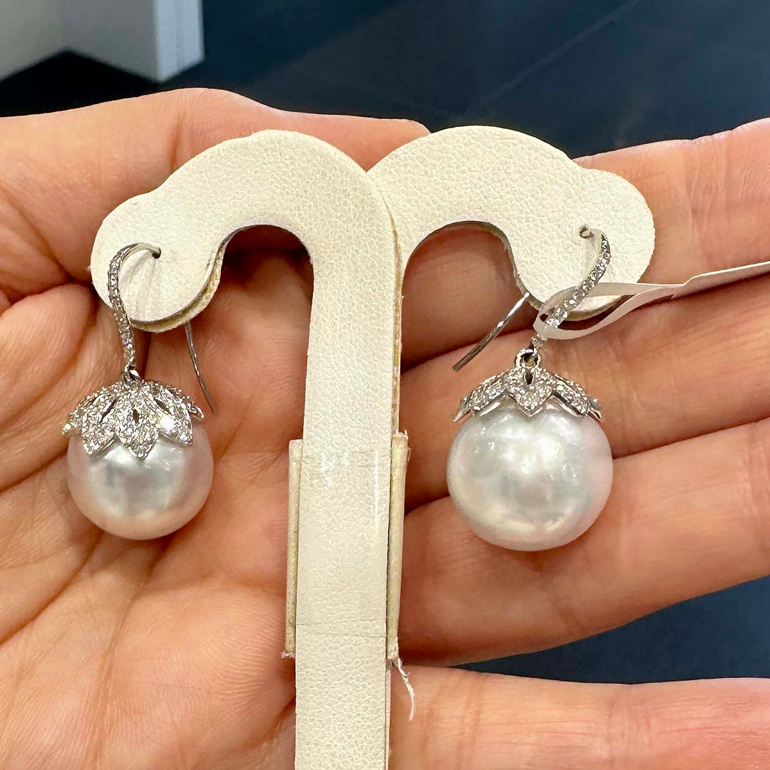 South Sea pearl drop earrings with 15.7mm white pearls, 14K white gold, and natural diamonds. Clean, blemish-free surface.