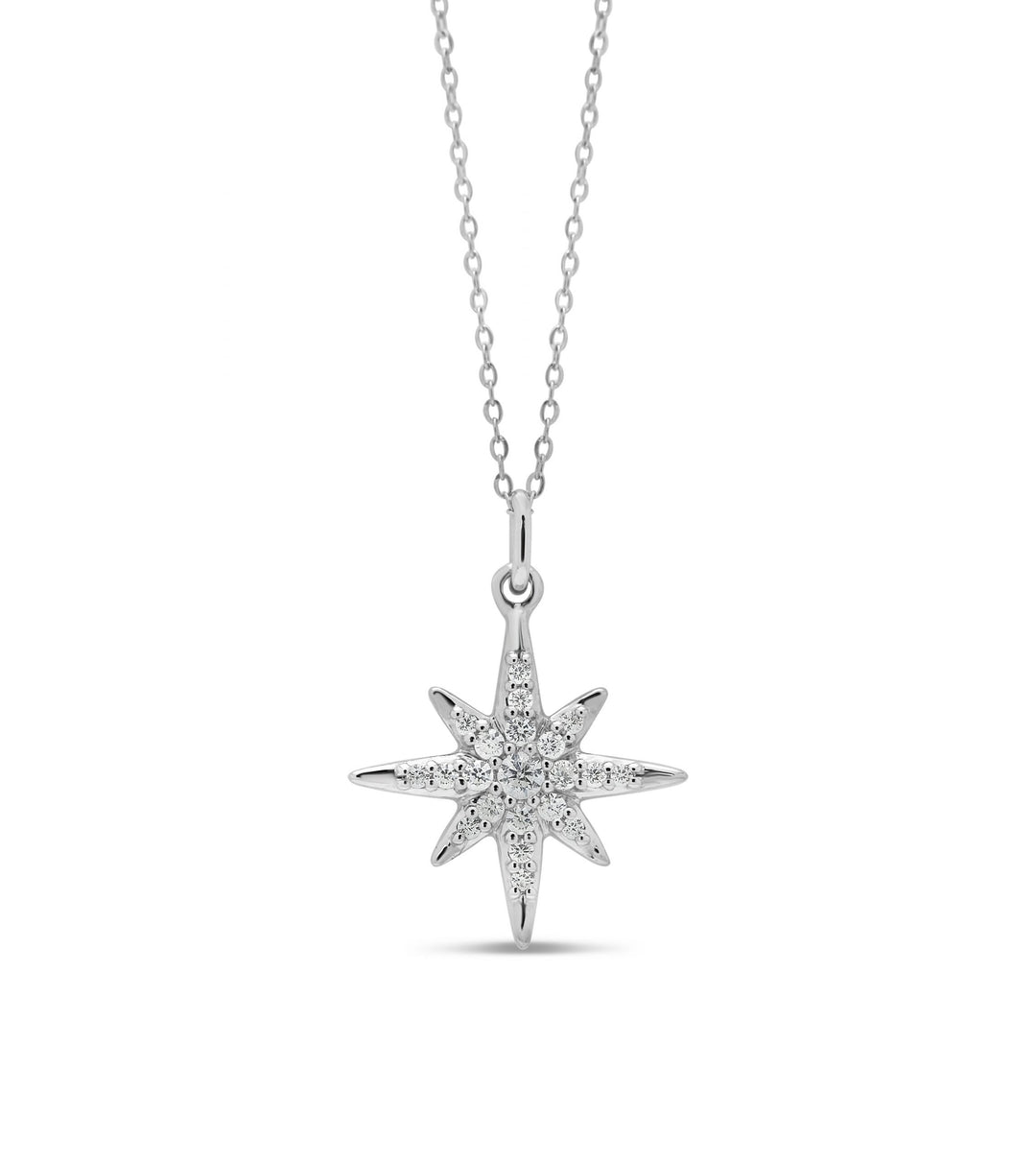Elegant 10K white gold North Star pendant adorned with 0.10 ct of diamonds, hanging on a matching white gold chain, ideal for a touch of celestial charm.