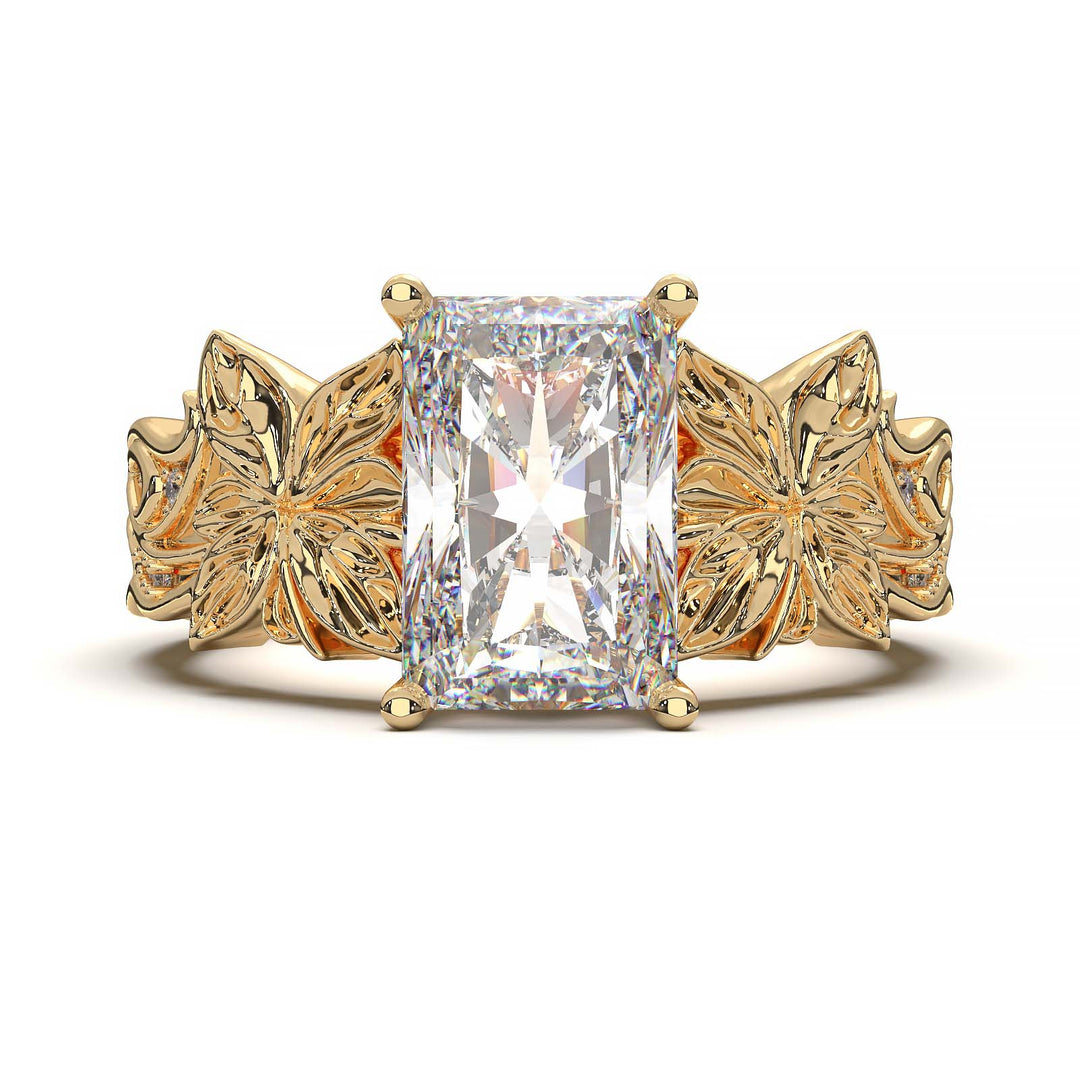 Radiant cut diamond engagement ring with floral leaf design.