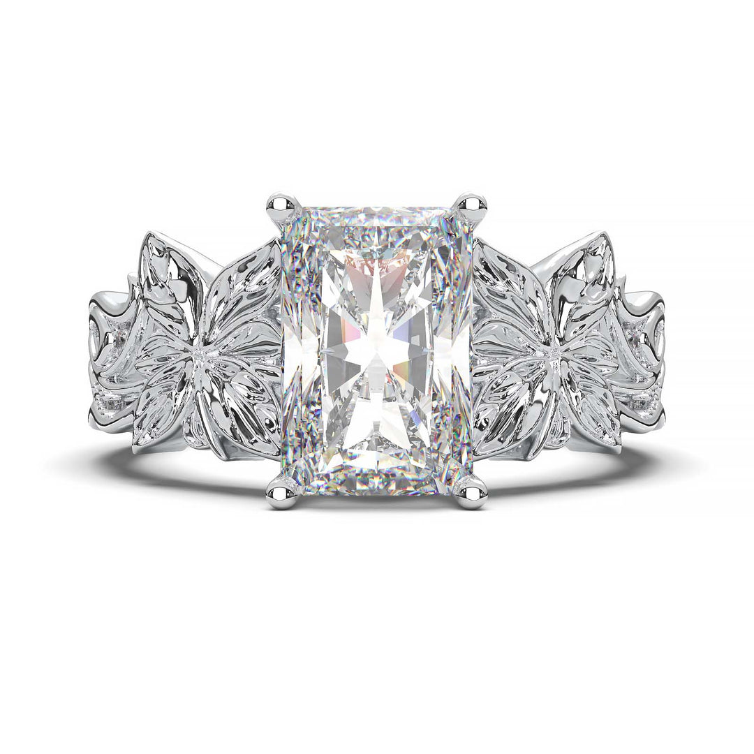 Radiant cut diamond engagement ring with floral leaf design.