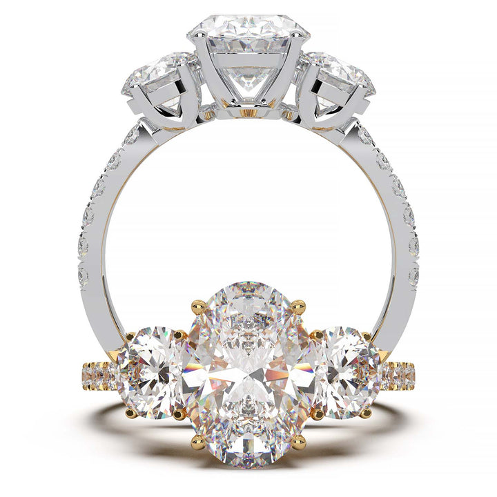Three-stone engagement ring with 2-carat oval lab-grown diamond, round side stones, and pave band