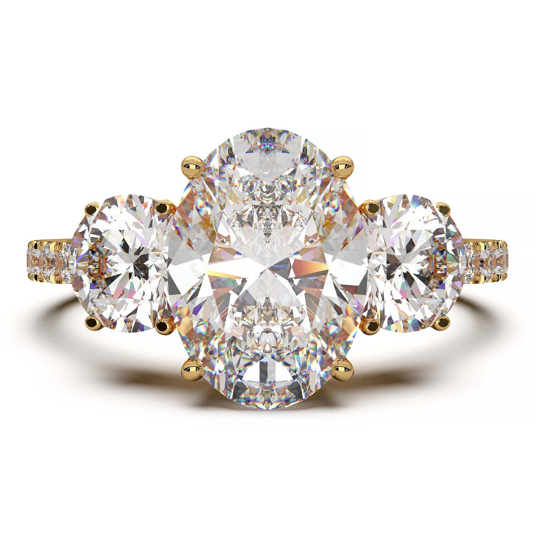 Three-stone engagement ring with 2-carat oval lab-grown diamond, round side stones, and pave band