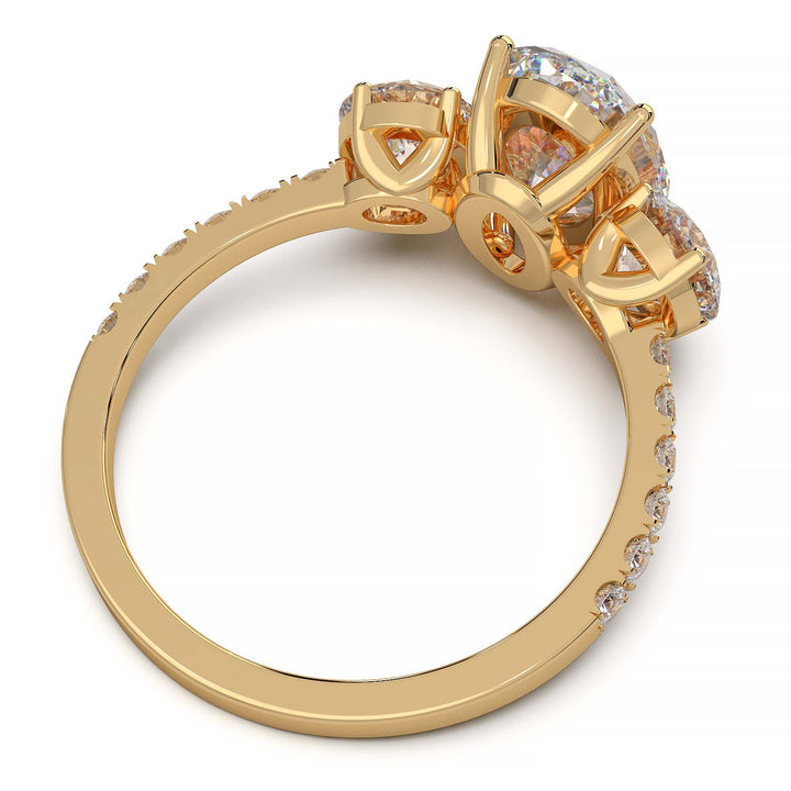 Three-stone engagement ring with 2-carat oval lab-grown diamond, round side stones, and pave band