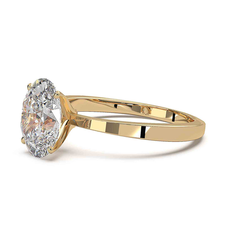 Oval diamond solitaire engagement ring with a tapered band, featuring a 1.6 CT lab-grown diamond, D color, VVS clarity.