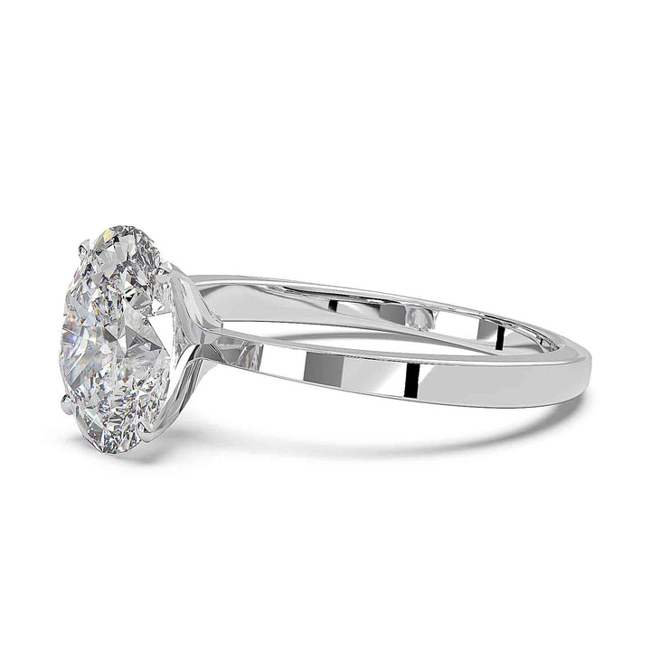 Oval diamond solitaire engagement ring with a tapered band, featuring a 1.6 CT lab-grown diamond, D color, VVS clarity.
