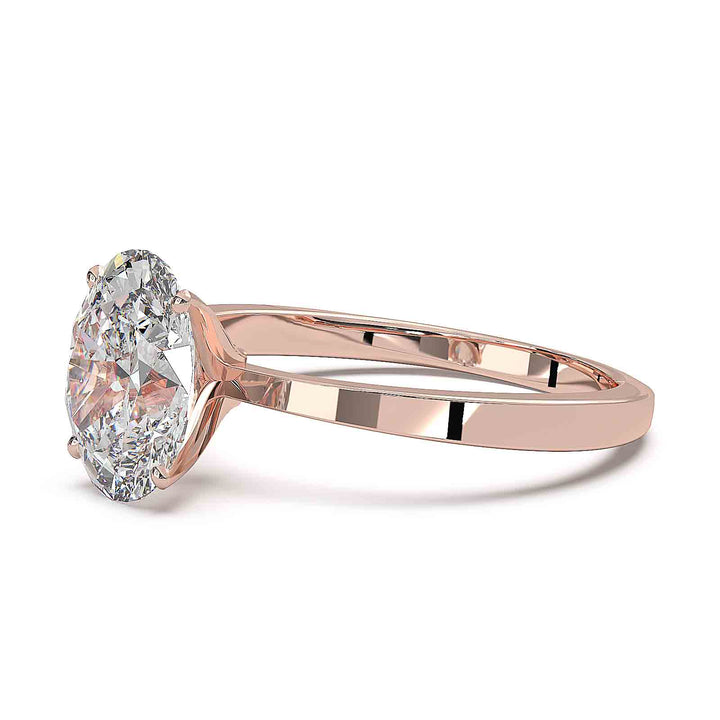 Oval diamond solitaire engagement ring with a tapered band, featuring a 1.6 CT lab-grown diamond, D color, VVS clarity.