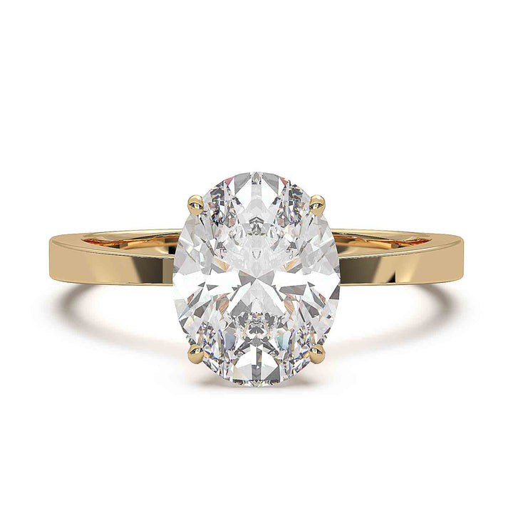 Oval diamond solitaire engagement ring with a tapered band, featuring a 1.6 CT lab-grown diamond, D color, VVS clarity.