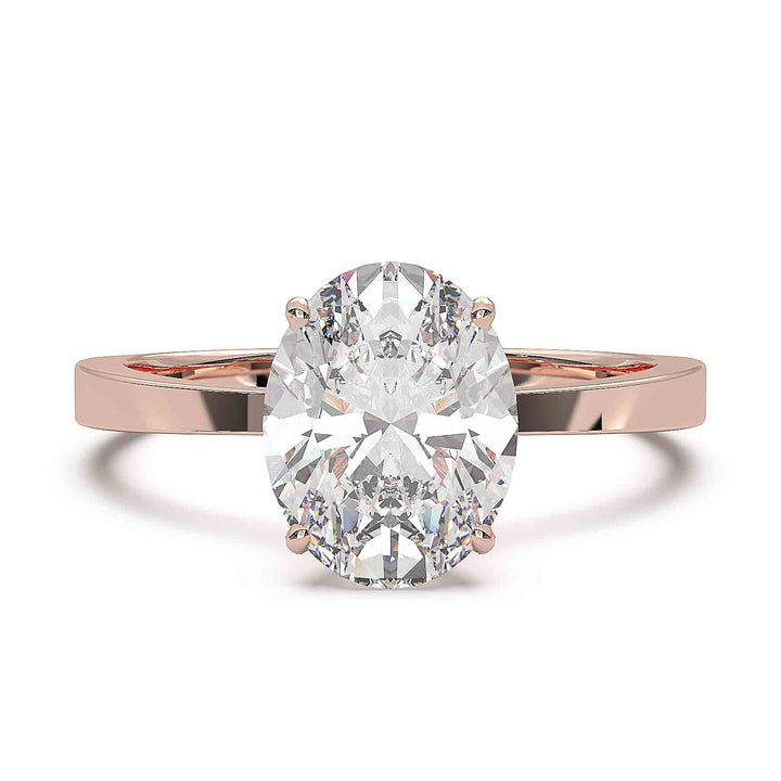 Oval diamond solitaire engagement ring with a tapered band, featuring a 1.6 CT lab-grown diamond, D color, VVS clarity.
