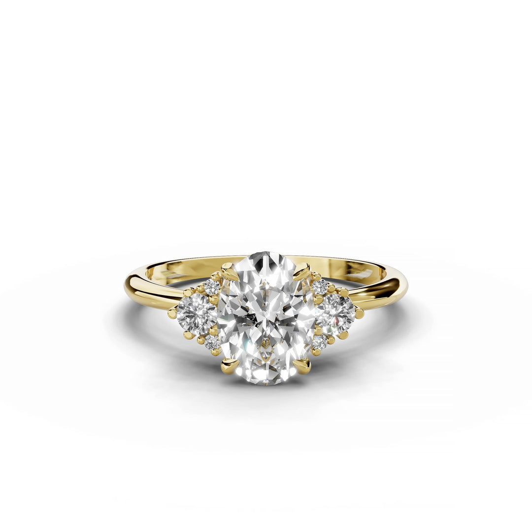 Oval diamond cluster engagement ring in yellow gold.