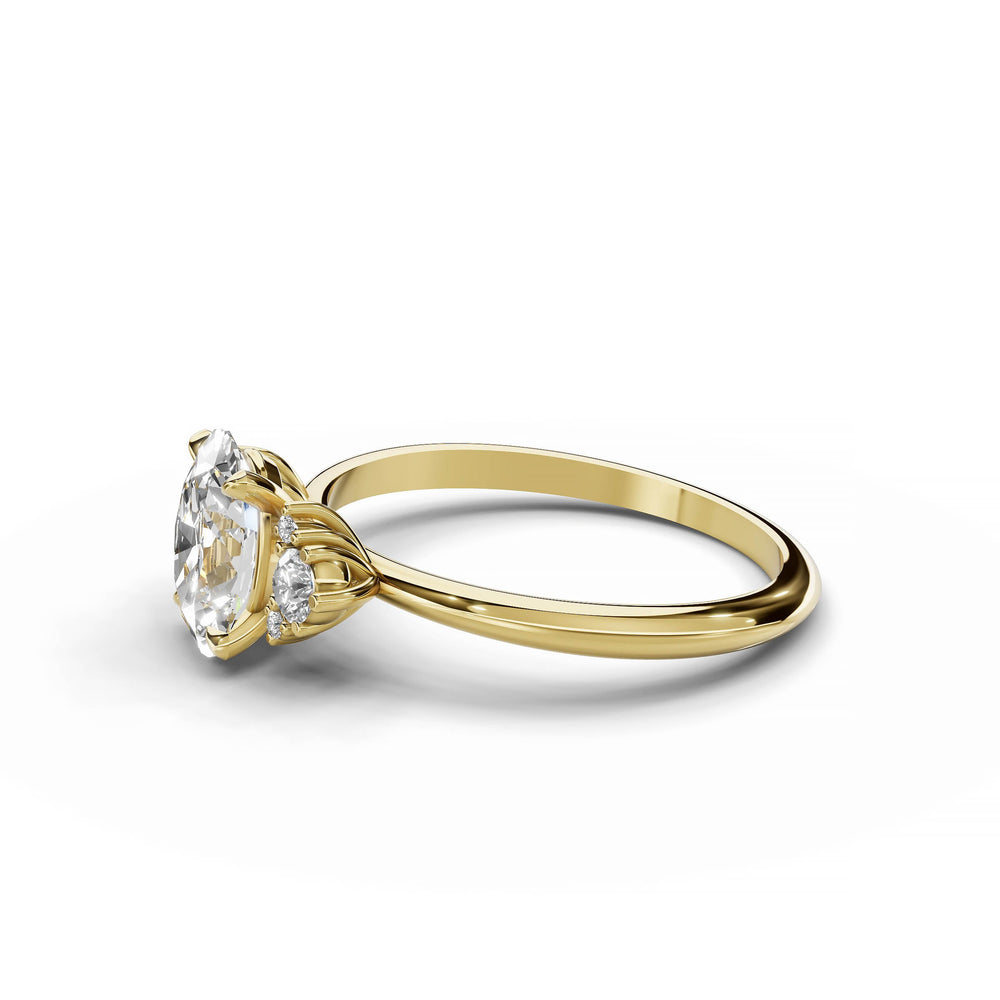 Oval diamond cluster engagement ring in yellow gold.