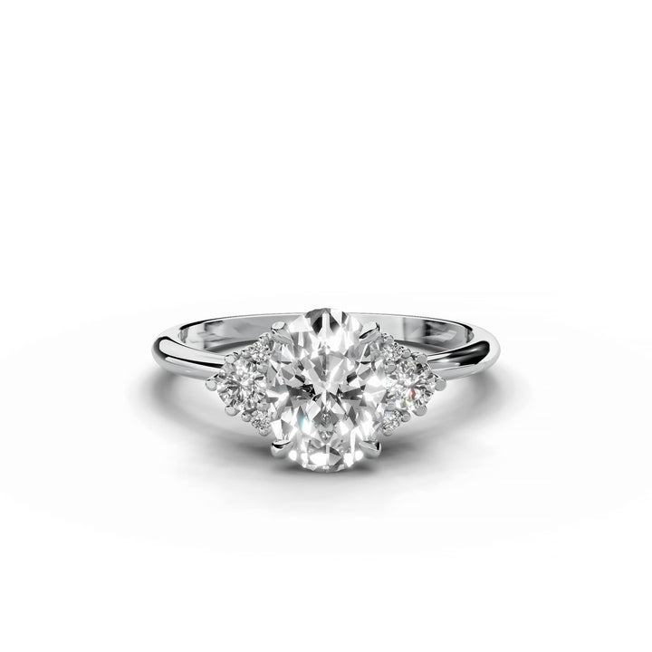 Oval diamond cluster engagement ring in white gold.
