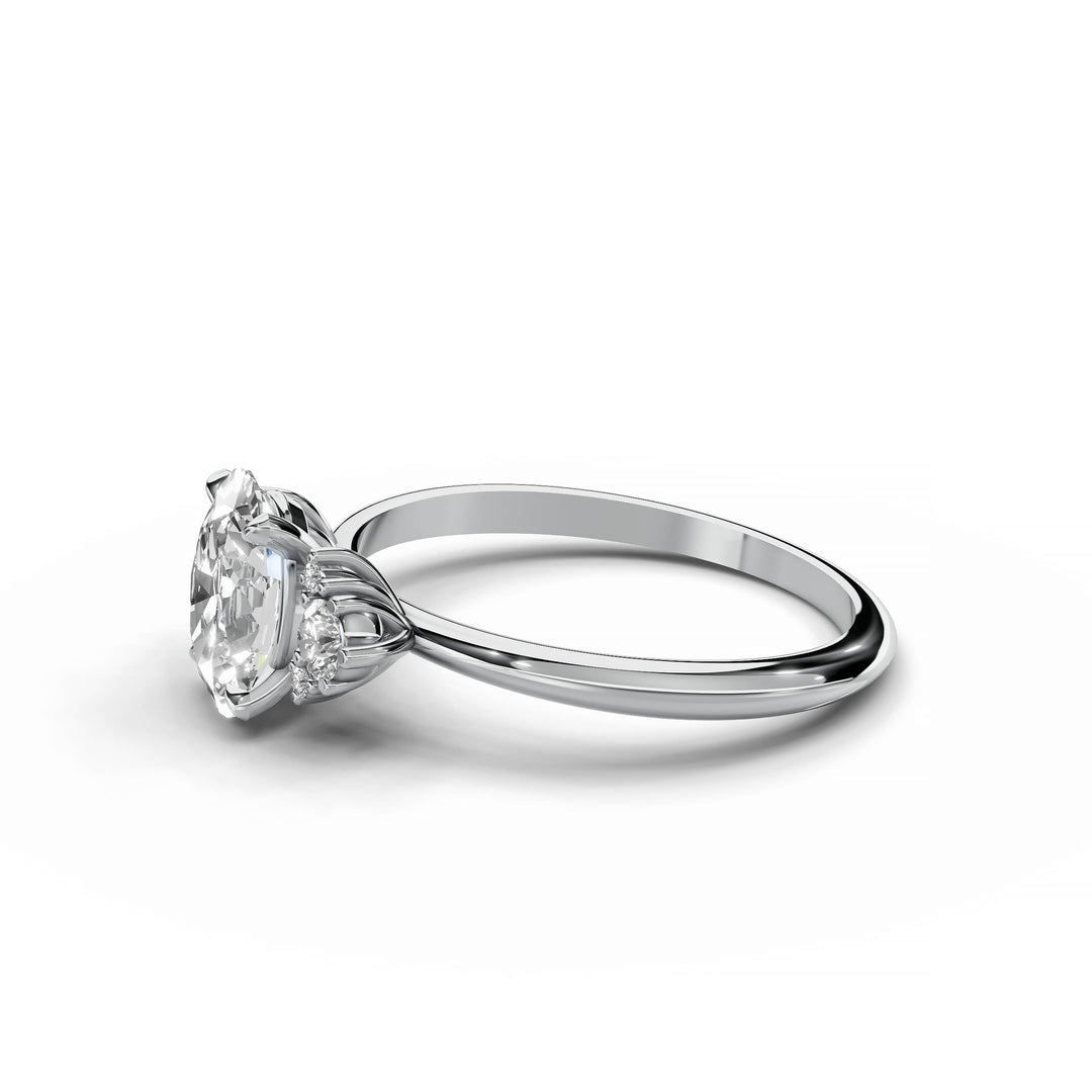 Oval diamond cluster engagement ring in white gold.