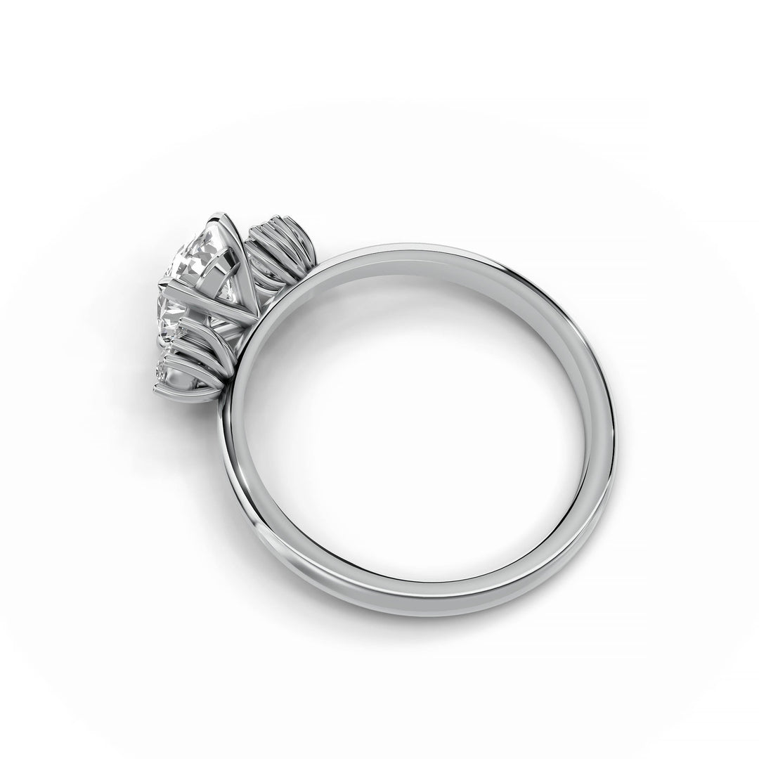 Oval diamond cluster engagement ring in white gold.