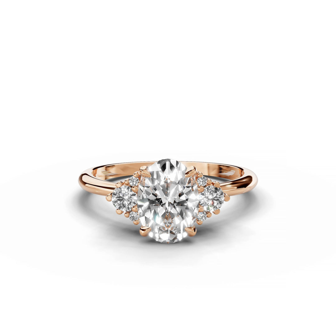 Oval diamond cluster engagement ring in rose gold.