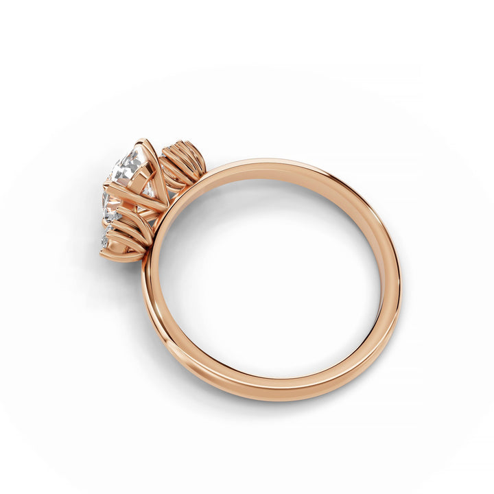 Oval diamond cluster engagement ring in rose gold.