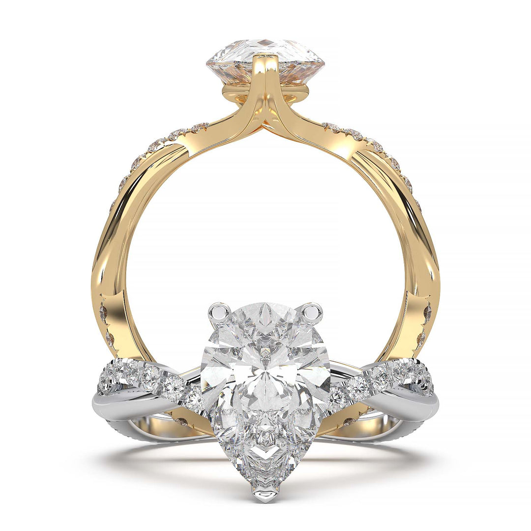 Moissanite pear-shaped engagement ring with 1.20CT center stone, accent moissanite, set in 14K gold.