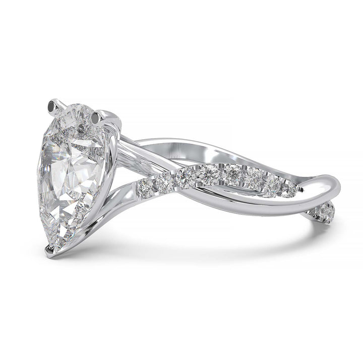 Moissanite pear-shaped engagement ring with 1.20CT center stone, accent moissanite, set in 14K gold.