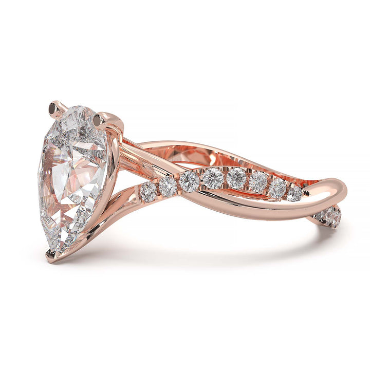 Moissanite pear-shaped engagement ring with 1.20CT center stone, accent moissanite, set in 14K gold.