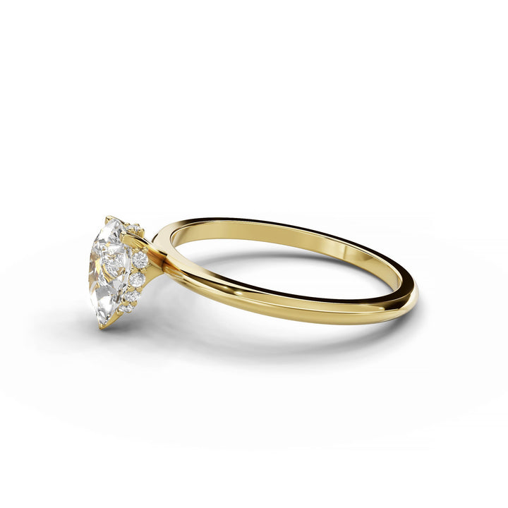 Pear-shaped diamond engagement ring, hidden halo, custom design, yellow gold.