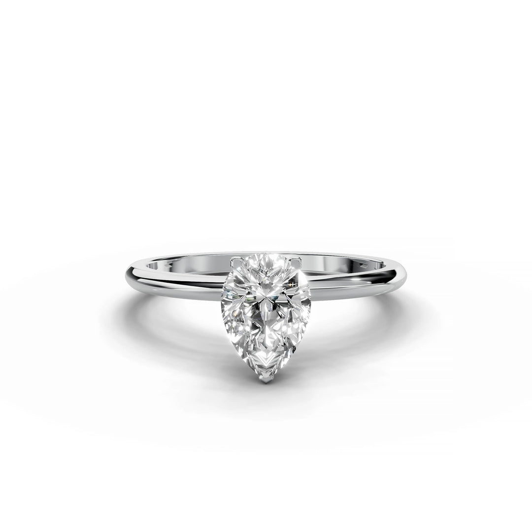 Pear-shaped diamond engagement ring in white gold with hidden halo design.