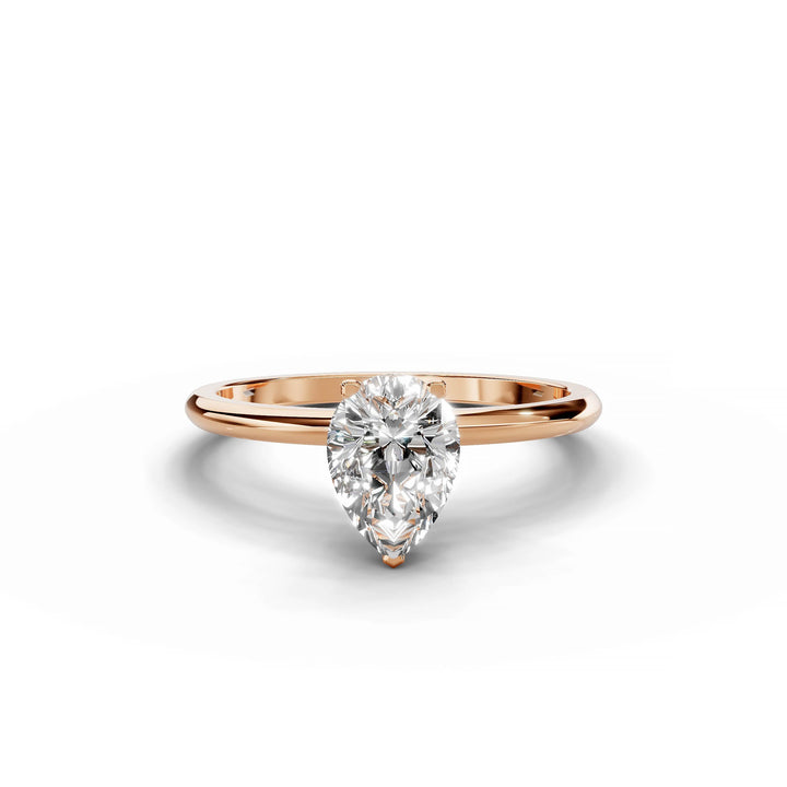 Pear-shaped diamond engagement ring in rose gold.