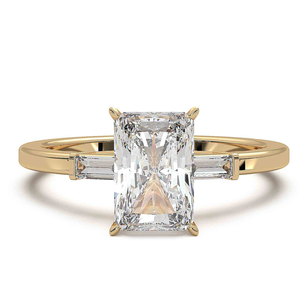Radiant cut diamond three-stone engagement ring with 1.5 CT lab-grown center diamond and baguette side stones in a modern design.