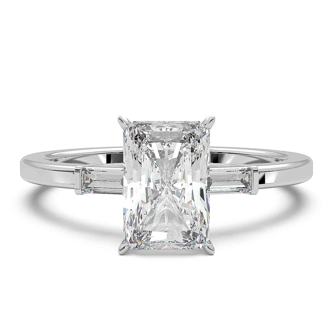 Radiant cut diamond three-stone engagement ring with 1.5 CT lab-grown center diamond and baguette side stones in a modern design.