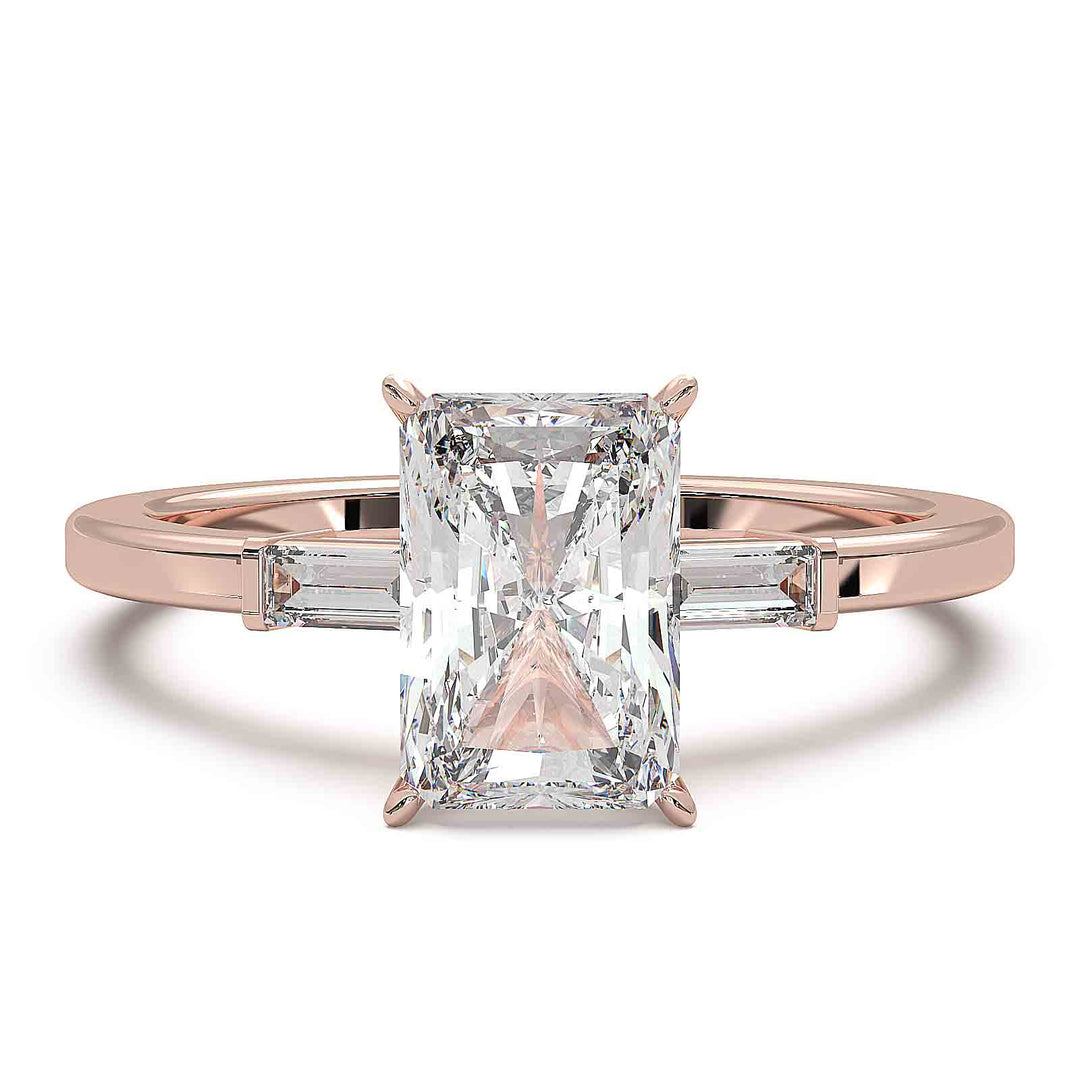 Radiant cut diamond three-stone engagement ring with 1.5 CT lab-grown center diamond and baguette side stones in a modern design.