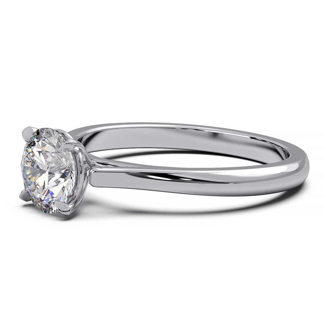 Elegant round cathedral setting engagement ring with a single diamond in a prong setting