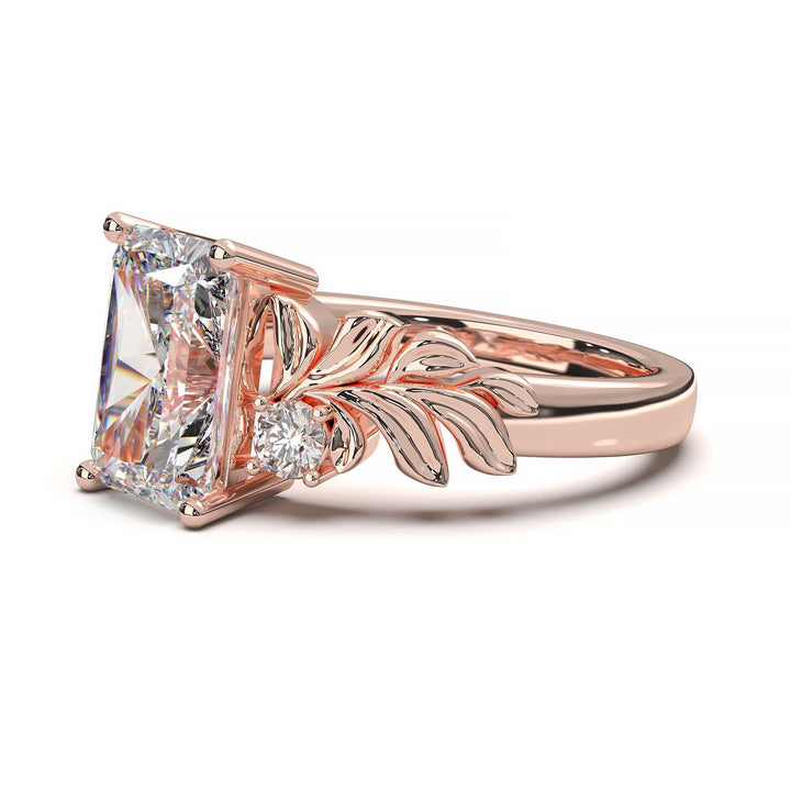 Radiant cut diamond engagement ring with leaf design.