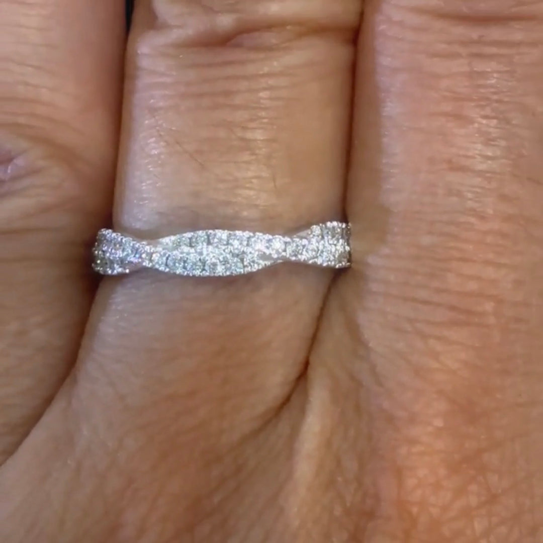 TWISTED LAB GROWN DIAMOND WEDDING-BAND on a finger