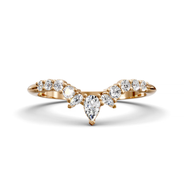 Curved V-shaped wedding band with pear center and side diamonds