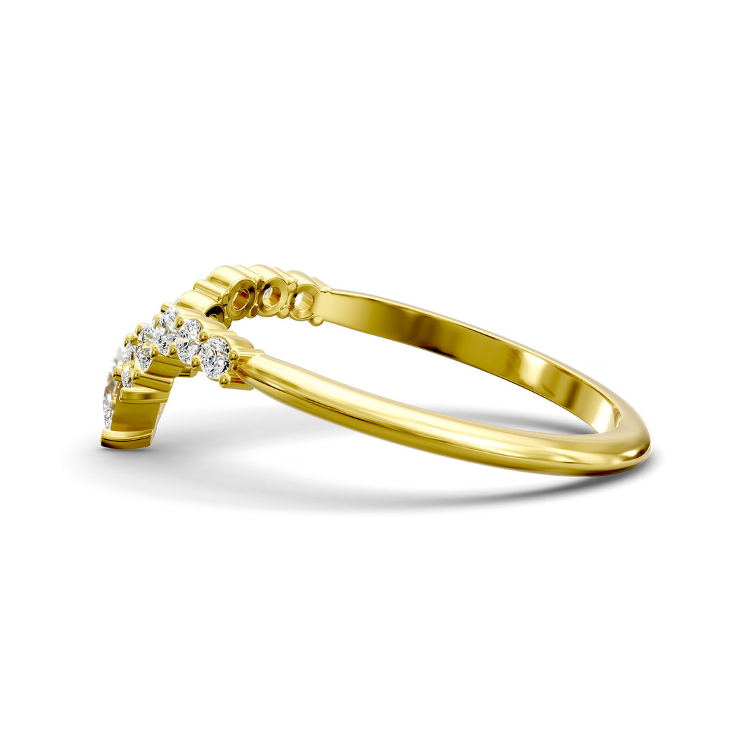 Curved V-shaped wedding band with pear center and side diamonds