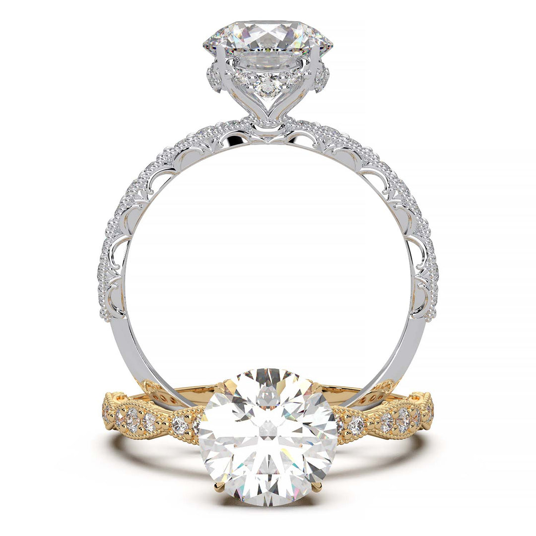 A vintage-style engagement ring featuring a large, round-cut diamond set in a gold band. The band is intricately detailed with smaller diamonds embedded in an ornate, floral and milgrain pattern, adding elegance and sparkle.