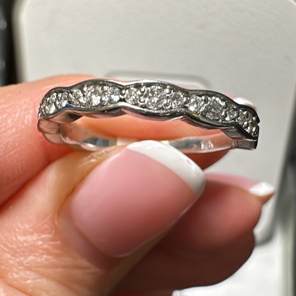 14K gold curved wedding band with 0.44 CT lab-grown diamonds.