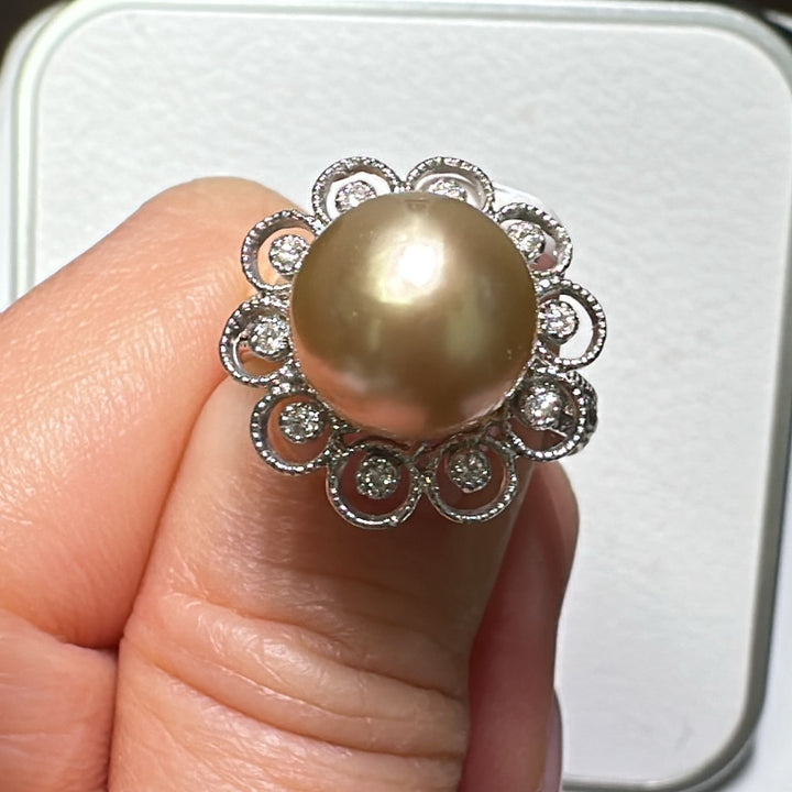 9mm Golden South Sea Pearl ring with diamond halo in 18K white gold.